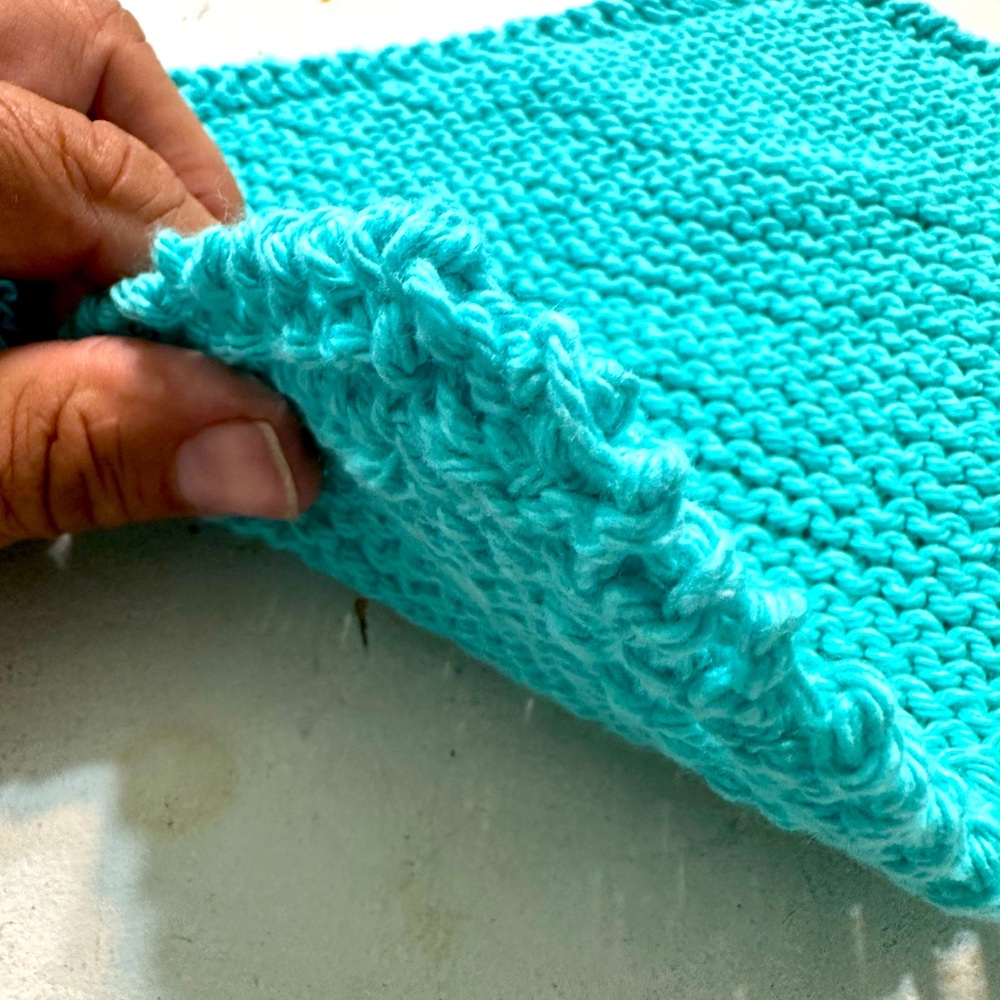 Fresh hand knitted cotton wash cloth by the wife. Turquoise in color.bin#6